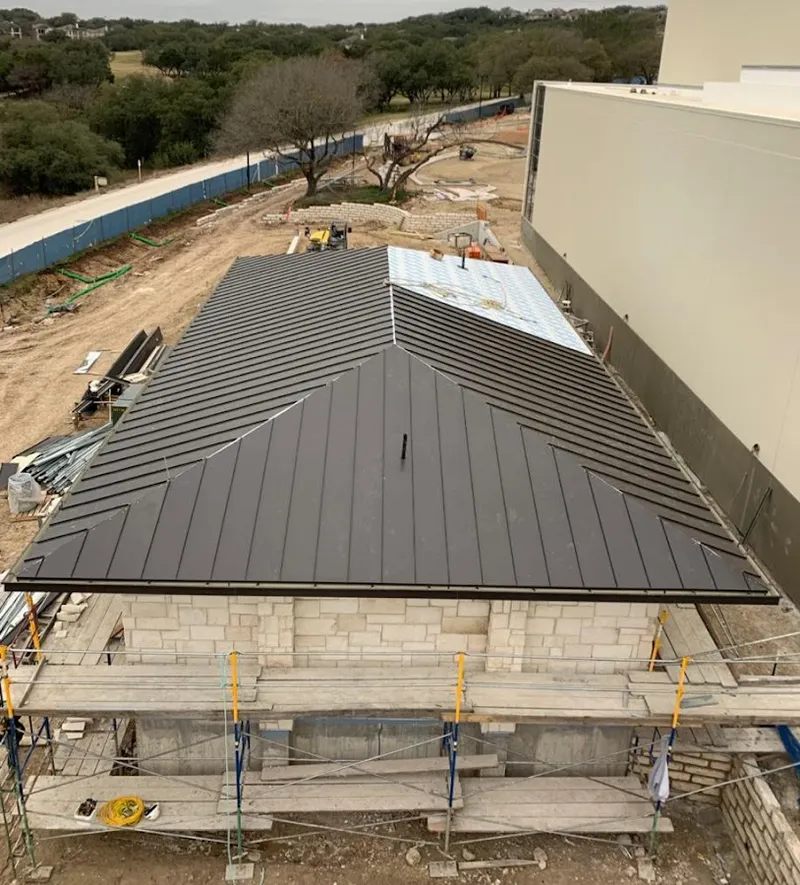 Metal roof new construction with scaffolding in Warwick
